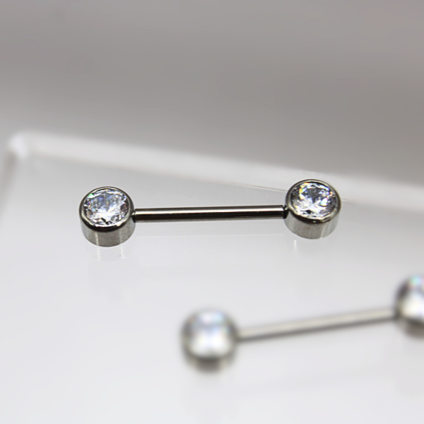 Barbell Titanio para Pezón diseño 2 pastillas de zirconias blancas
