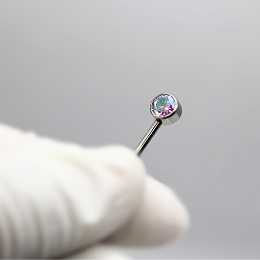 Barbell Titanio para Pezón  diseño 2 pastillas de zirconias tornasol