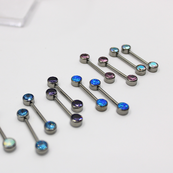 Barbell Titanio para Pezón diseño 2 pastillas de zirconias azules