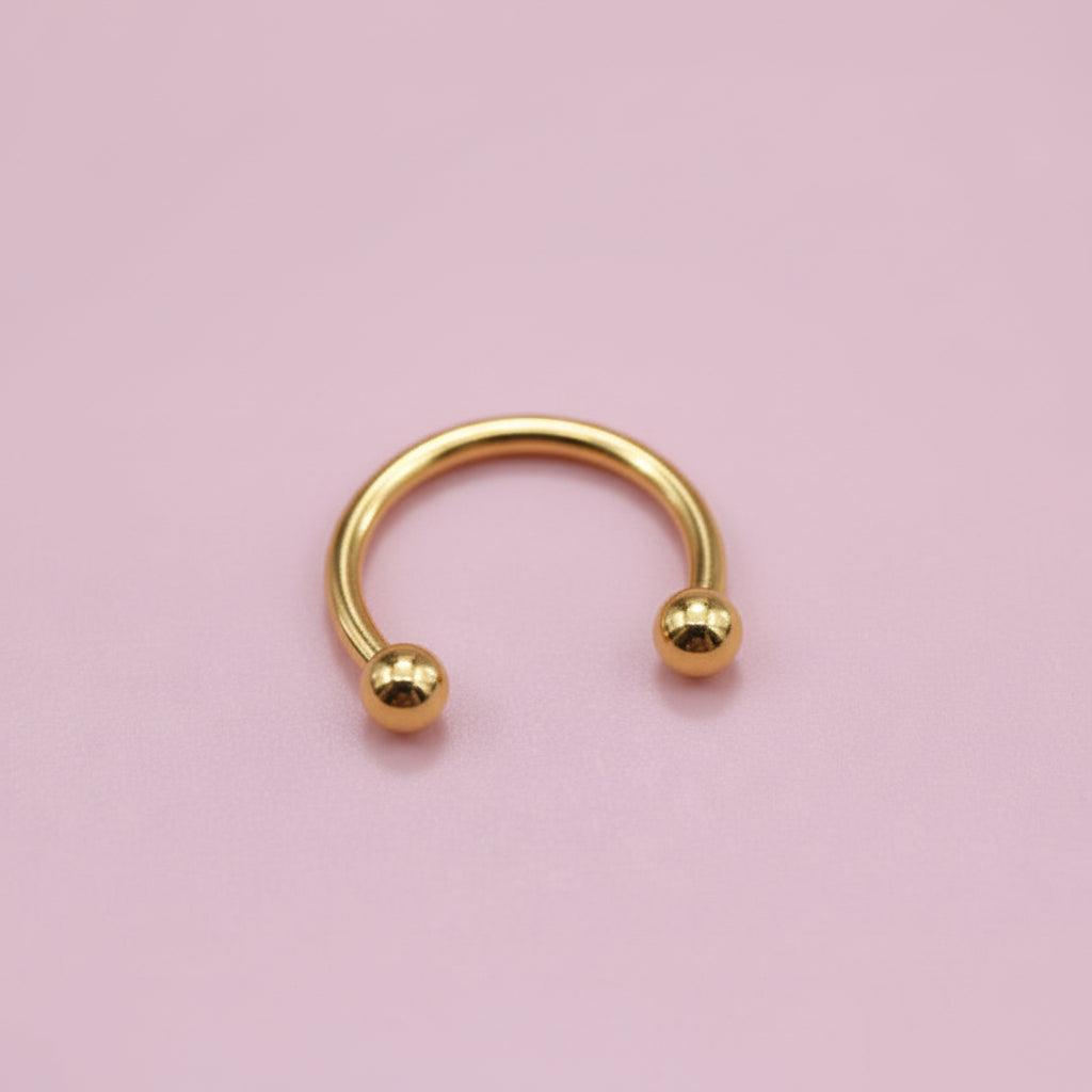 Piercing herradura dorada  - Titanio
