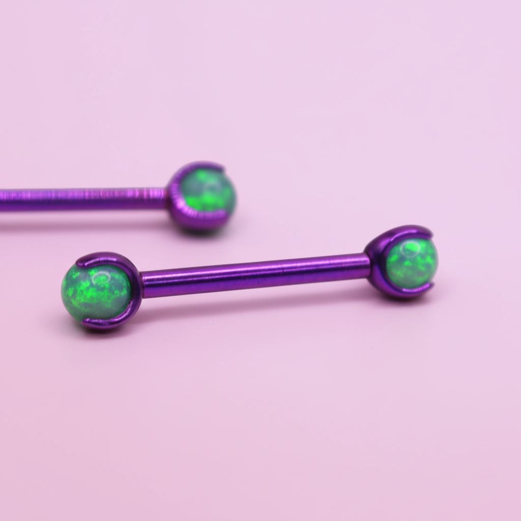 Barbell Titanio para Pezón Morado con Piedra Verde
